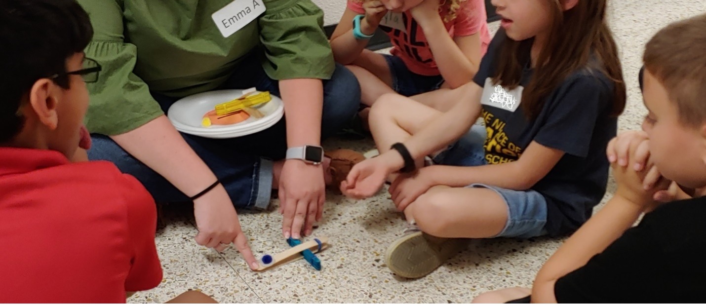 Engineering catapults made of popsicle sticks and rubber bands with 3rd graders.